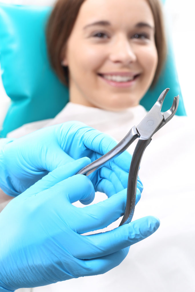 Woman at the dentist's chair during a root canal dental procedure