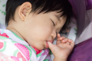 Baby napping and thumb sucking